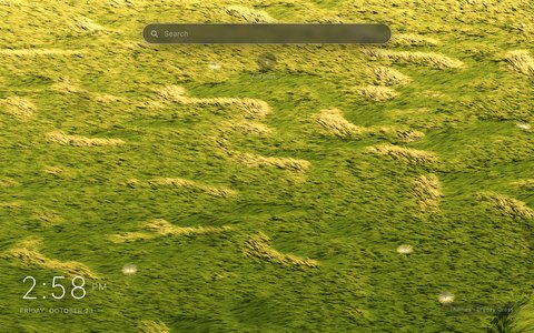 Breezy Grass New Tab theme: a field of green and gold grass seen from above, with pale wind waves rolling across it