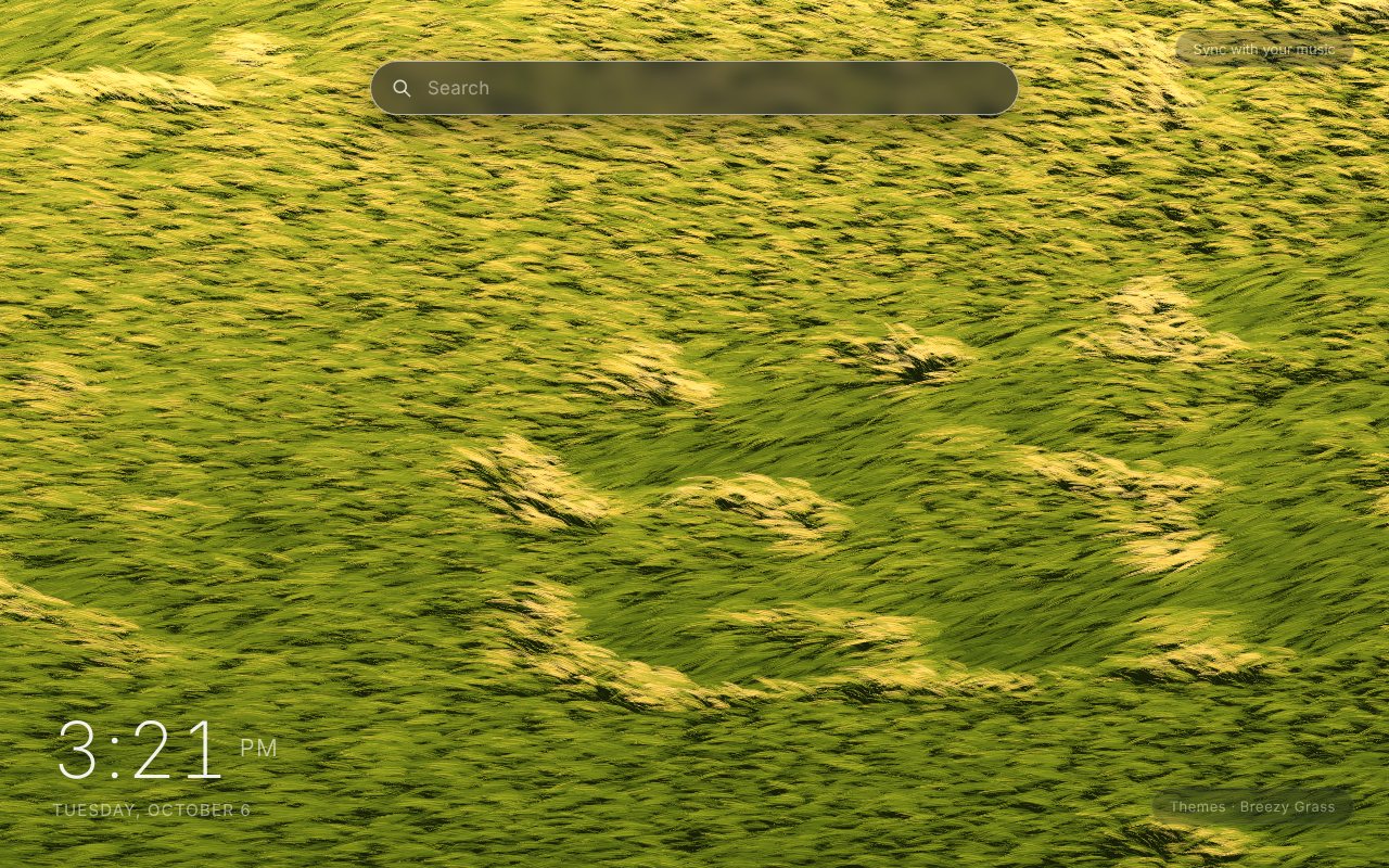 Breezy Grass New Tab theme: a field of green and gold grass seen from above, with pale wind waves rolling across it