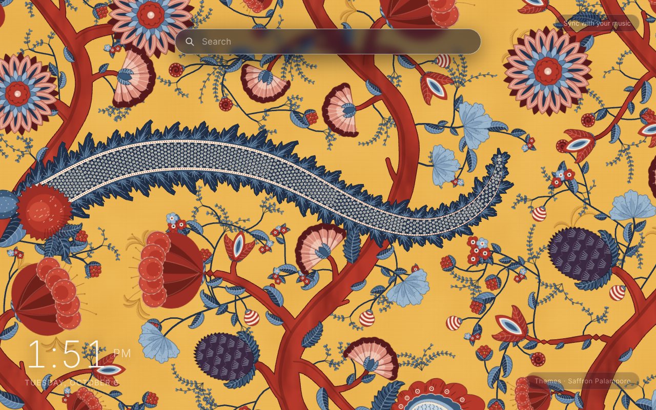 Saffron Palampore New Tab theme: coral-red trunks, indigo leaves, red and pink block-print flowers and a blue scale-patterned serpent vine on a saffron-yellow ground